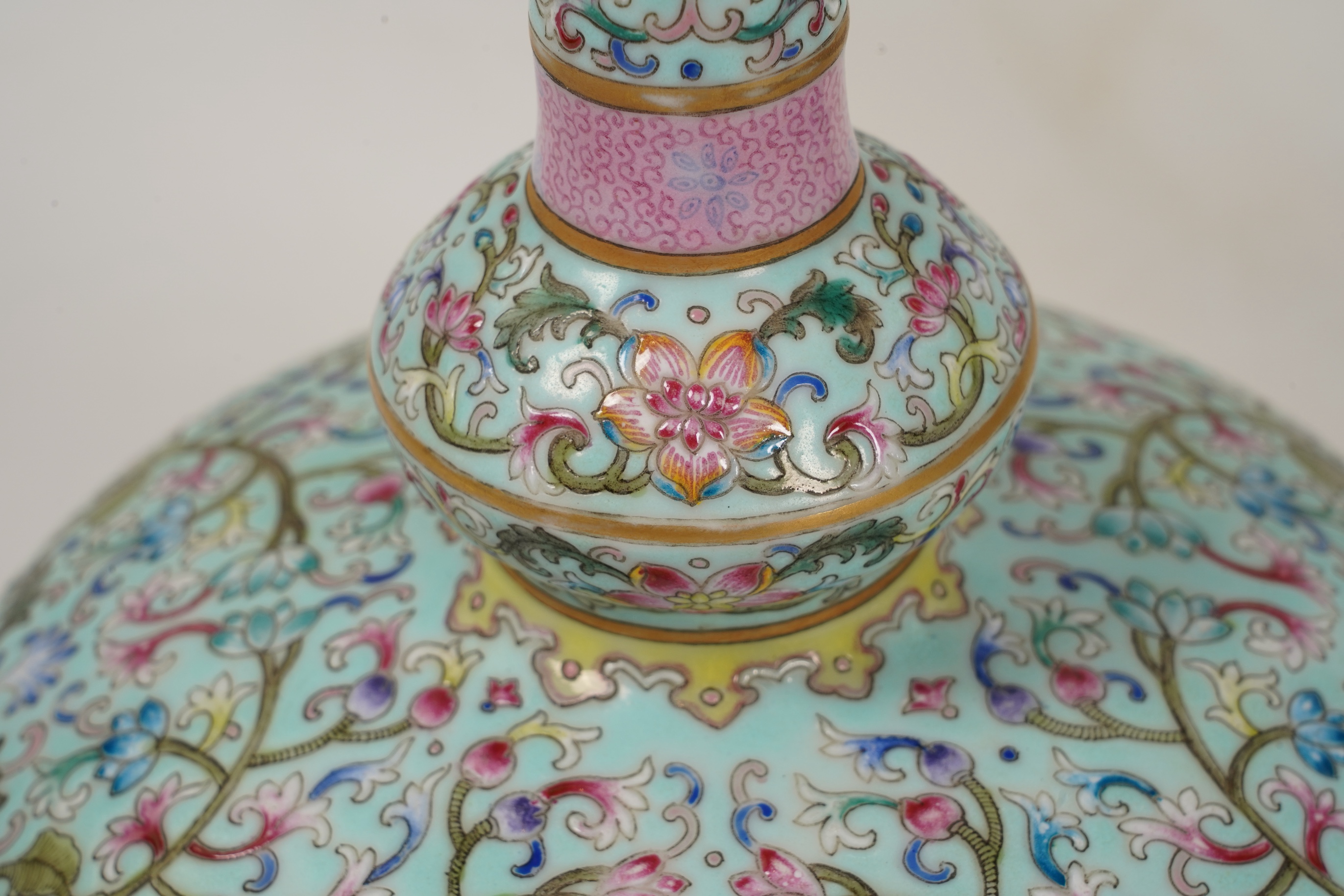 A pair of Chinese famille rose enamelled porcelain bottle vases, Qianlong seal mark to base but Republic Period
